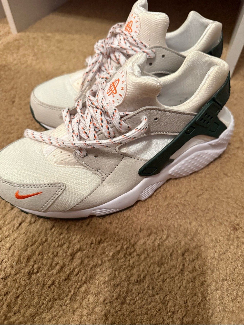 Nike Kids White Sneakers with Dark Green Heel Cage and Orange Accents